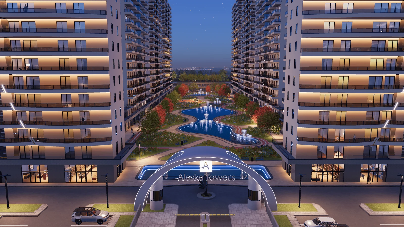 مدخل Alaska Towers في أربيل، مع شقق مضاءة وساحة داخلية منسقة